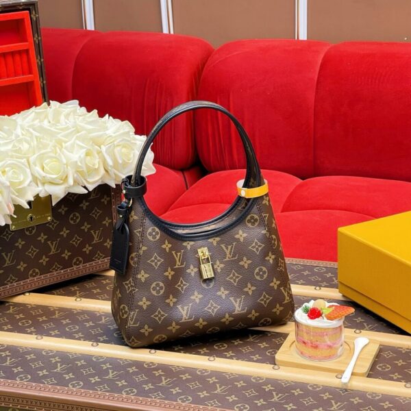 Louis Vuitton The Drop PM Handbag in Monogram Coated Canvas